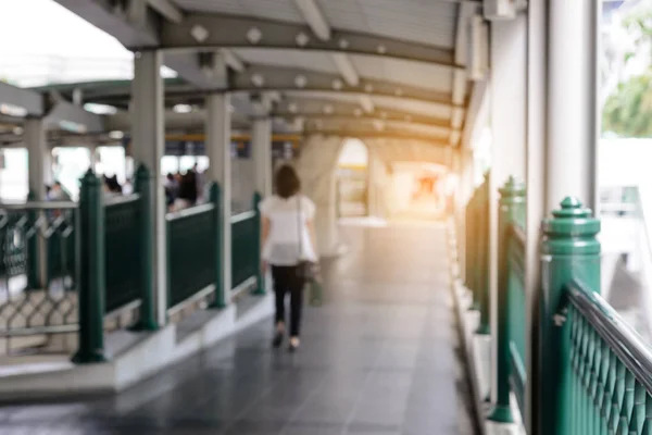 Blurred people walking on skywalk under electric train station in Bangkok City, Thailand - City Concept — Stock Photo, Image