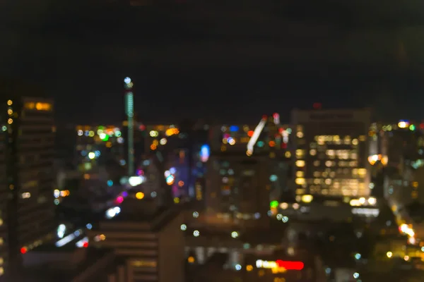 Abstrakt bokeh staden nattlampa - stadsbilden bakgrund — Stockfoto
