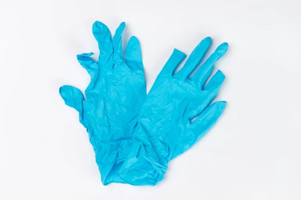 白い背景の使用後医療用手袋ブルー — ストック写真