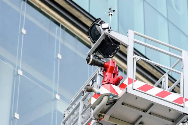 Close up empty safety fire engine ladder basket on crane near building — Stock Photo, Image