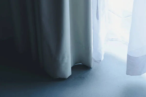 Close up of curtain with white sheer curtains. draperies at a window