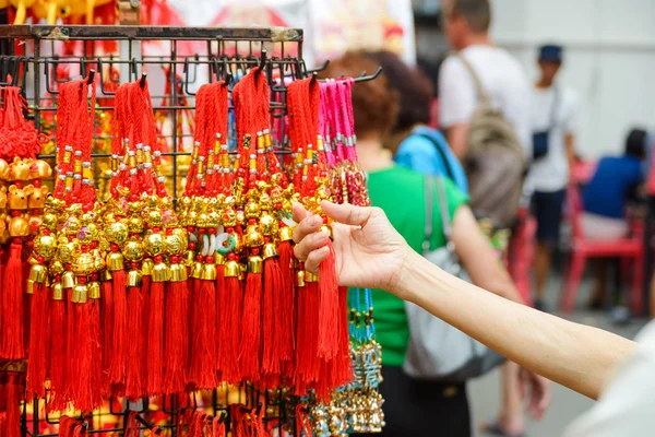 Old women holding Chinese new year talisman gift decoration for celebrate Year of the Rat. For good luck with Chinese alphabet all means good luck and good fortune — Stock Photo, Image