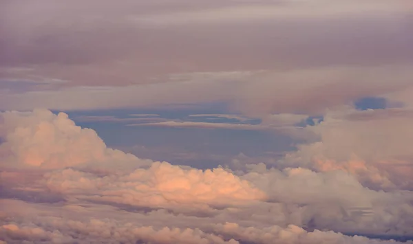 Beautiful view of sunset or sunrise clouds and sky from airplane window — Stock Photo, Image