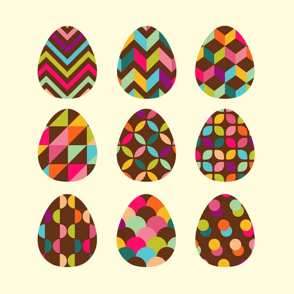 Ensemble de Pâques d'oeufs en chocolat. Carte de vœux aux œufs peints géométriques . — Image vectorielle