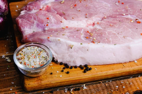 Raw ham composition on a wooden background — Stock Photo, Image