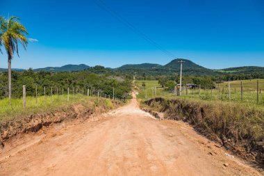 Typical red sand path in Paraguay: here, from the Colonia Independencia to the Ybytyruzu mountains. clipart