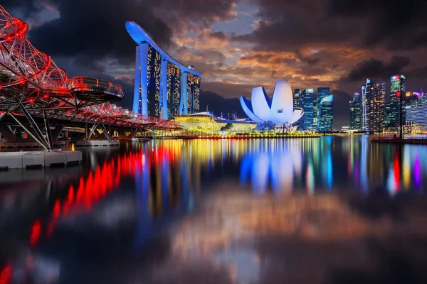 Singapore city reflecting in water at Marina Bay