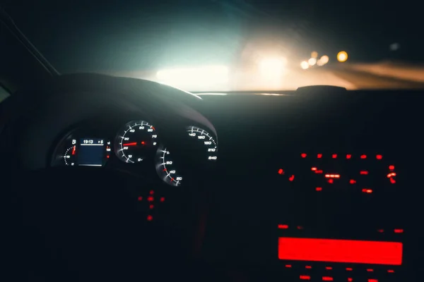 Driving car at night highway. Inside interior view. Illuminated dashboard — Stock Photo, Image