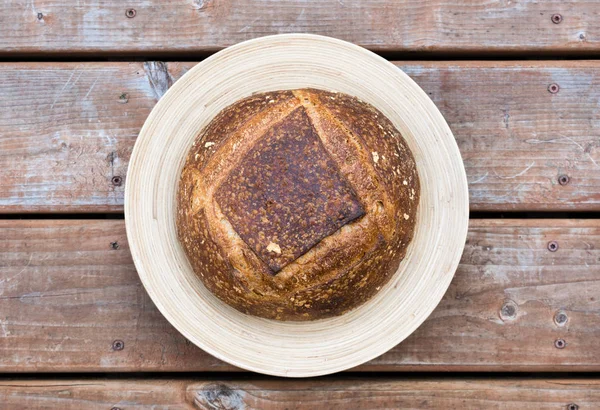 Homemade round bread on a plate — Stock Photo, Image