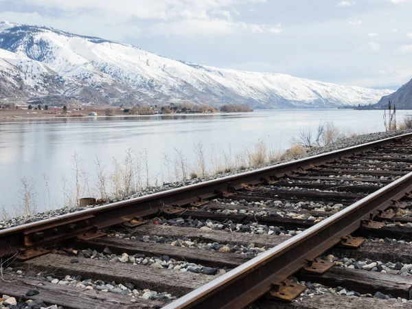 Railroad Tracks Running Snow Covered Columbia River Valley North Wenatchee Stock Photo