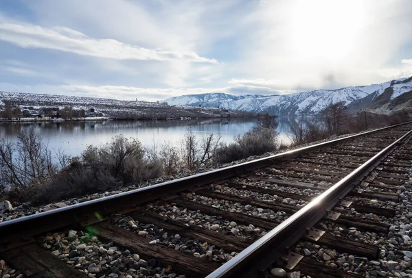 Railroad Tracks Running Snow Covered Columbia River Valley North Wenatchee Royalty Free Stock Images