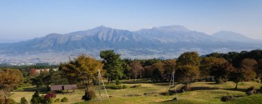 Morning view of the 5 peaks of Aso from the southern rim of Aso volcanic caldera - Aso-Kuju National Park, Kumamoto Prefecture, Japan clipart