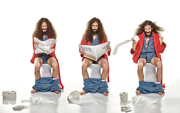 Multiple portrait of a man sitting on a lavatory — Stock Photo, Image