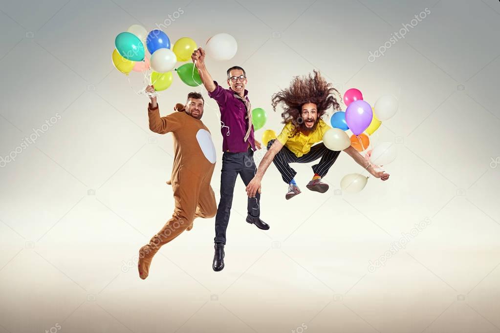 Portrait of group of funny friends on a party