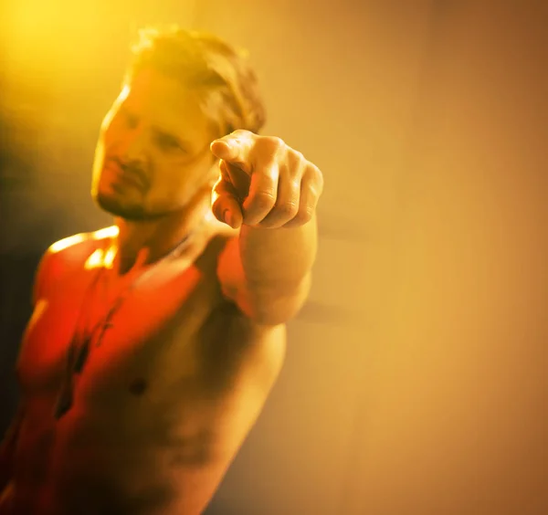 Blurred portrait of a handsome, muscular guy — Stock Photo, Image