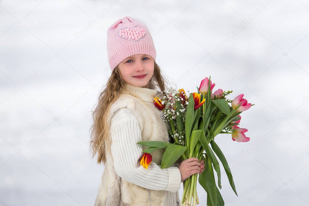 Girl with a bouquet of Tulip flowers in her hands. World mother