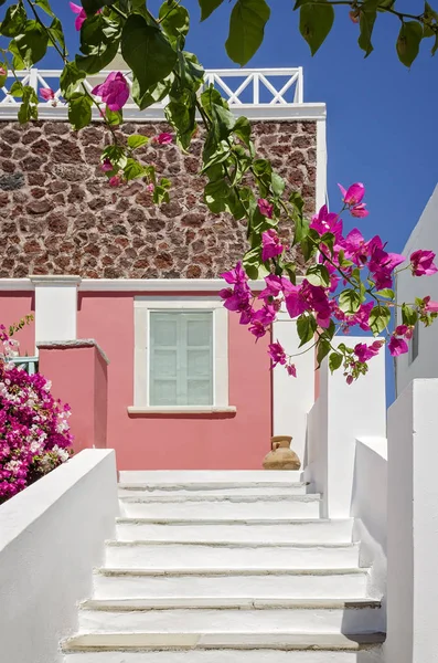 Classical Greek architecture of the streets with white stairs, Santorini Island in Greece.