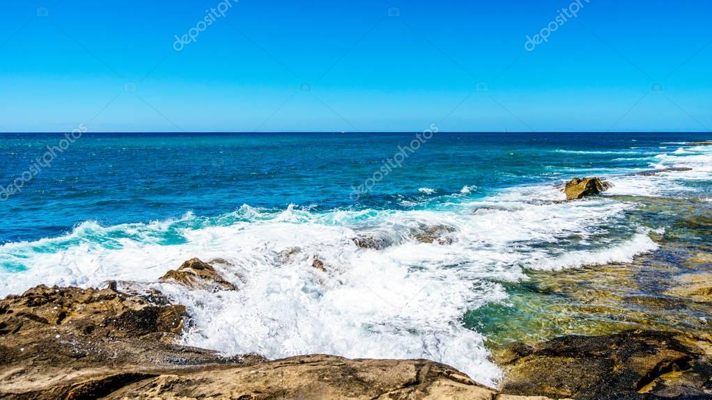 Waves of the Pacific Ocean on the shoreline of Ko Olina on the island of Oahu in Hawaii