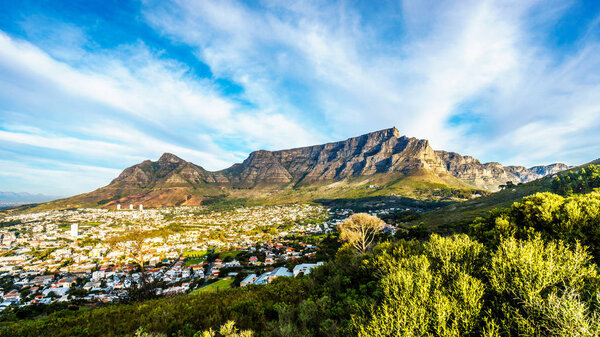 Sun setting over Cape Town, Table Mountain, Devils Peak and the Twelve Apostles