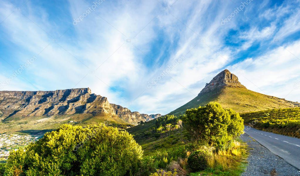 Sun setting over Table Mountain, Lions Head and the Twelve Apostles