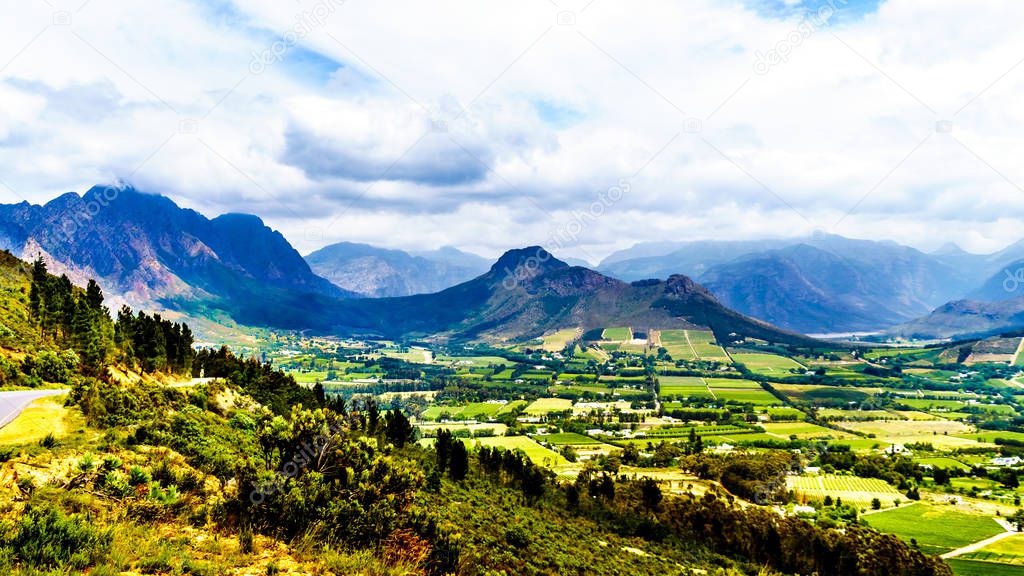 Franschhoek Valley in the Western Cape province of South Africa with its many vineyards that are part of the Cape Winelands, surrounded by the Drakenstein mountain range, as seen from Franschhoek Pass