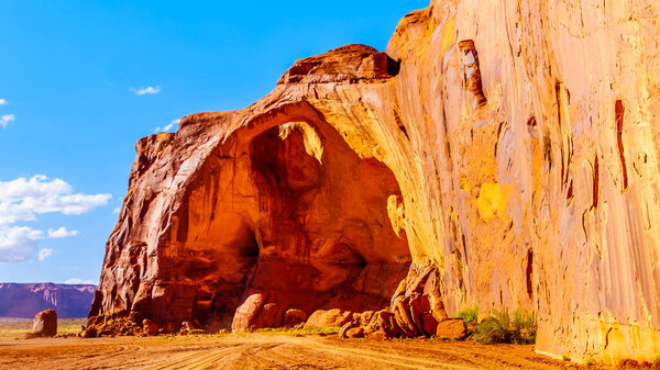 The Sun 's Eye, a hole in the ceiling of a large Sandstone Formation, in Monument Valley Navajo Tribal Park on the Utah and Arizona border, United States
