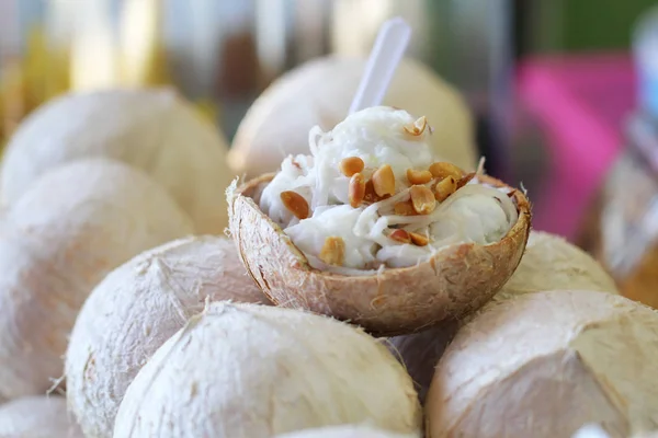 Coconut Ice Cream with nuts and coconut flake in coconut ball — Stock Photo, Image