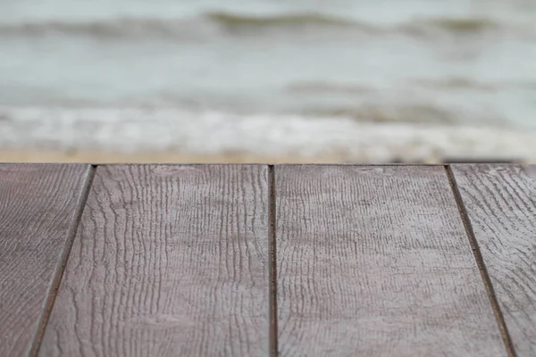 empty brown wooden texture table with sea nature background