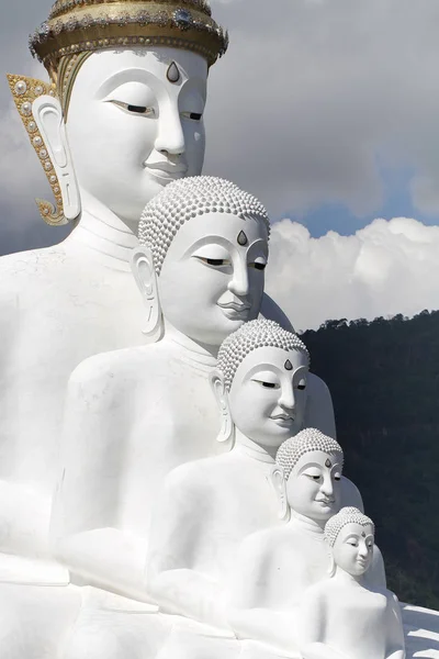 Five white buddha statues sitting well alignment in front of blue sky and decorating wonderful attractive mirror, one of the most interesting landmark in north of Thailand