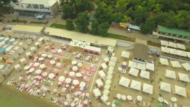 Aerial View. Popular city beach. Many sun umbrellas at the coast, 4K — Stock Video