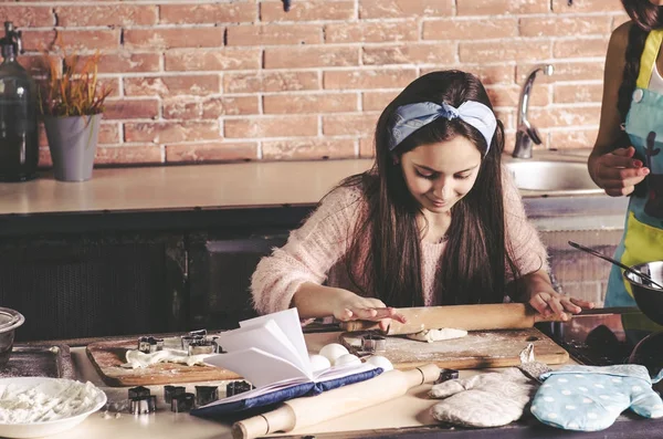 Girl making cookies and braking egg — Stock Photo, Image