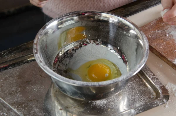 Egg yolk with flour in silver bowl — Stock Photo, Image