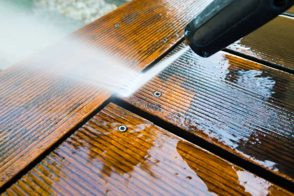 Cleaning terrace with a power washer — Stock Photo, Image