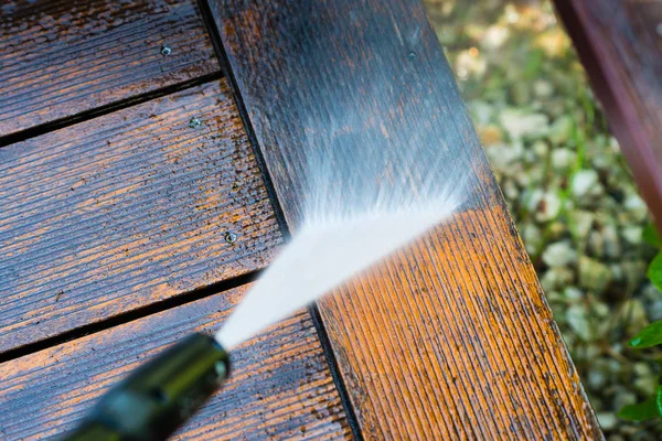 Cleaning terrace with a power washer — Stock Photo, Image