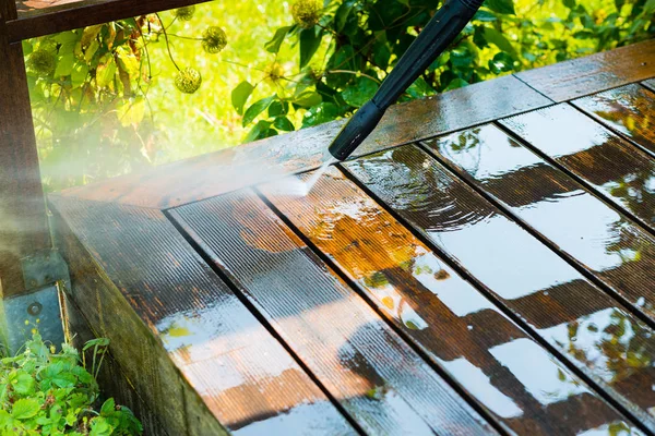 Cleaning terrace with a power washer — Stock Photo, Image