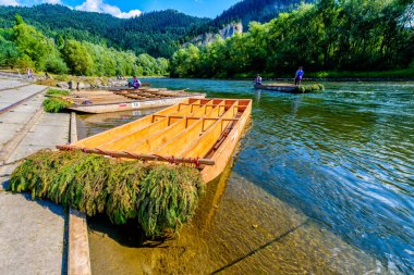 Sromowce Nizne, Poland - August 26, 2015; Traditional rafting on the Dunajec River on wooden boats. The rafting is very popular tourist attraction in Pieniny National Park