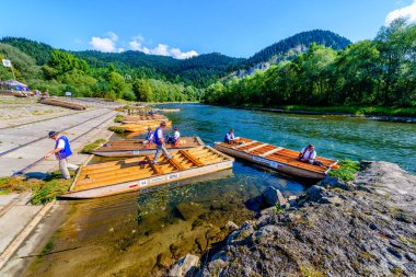Sromowce Nizne, Poland - August 26, 2015; Traditional rafting on the Dunajec River on wooden boats. The rafting is very popular tourist attraction in Pieniny National Park