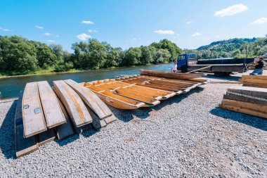 Sromowce Nizne, Poland - August 26, 2015; Traditional rafting on the Dunajec River on wooden boats. The rafting is very popular tourist attraction in Pieniny National Park