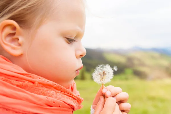 Little Girl Orange Shawl Blowing Dandelion — Stock Photo, Image
