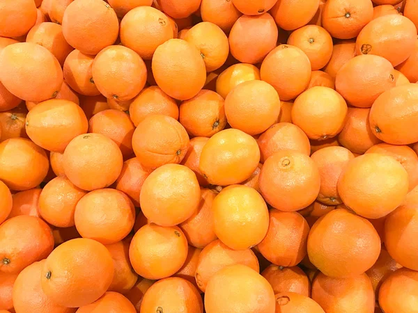 heap of fresh mandarin oranges texture background