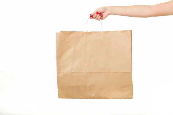 Ragazza con borse della spesa su uno sfondo bianco — Foto Stock