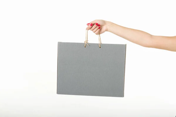 Chica con bolsas de compras sobre un fondo blanco — Foto de Stock