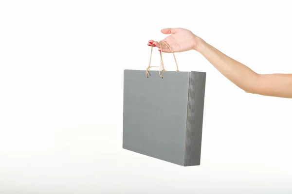 Mädchen mit Einkaufstaschen auf weißem Hintergrund — Stockfoto