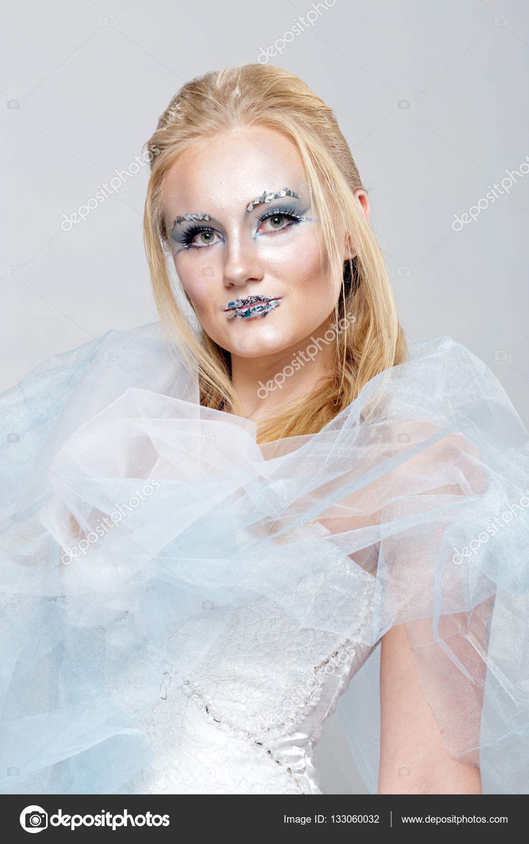 Blonde In A White Dress With Blue Makeup The Snow Queen Stock