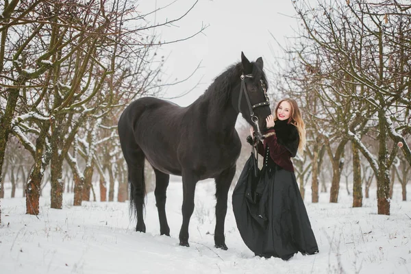 Horse and girl in winter woods — Stock Photo, Image