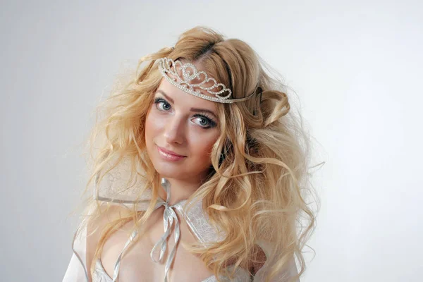 Girl with lush hair dressed as the Snow Queen — Stock Photo, Image