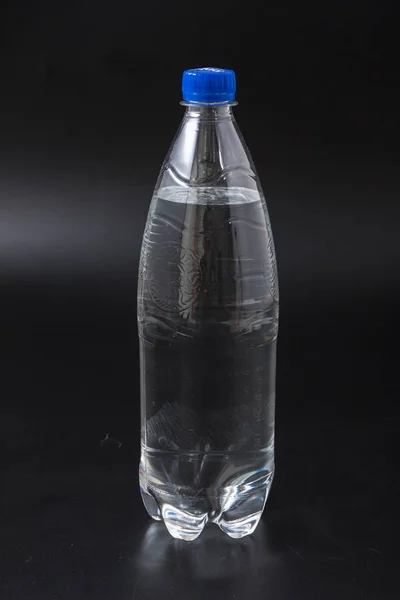 Water bottle isolated on black background. — Stock Photo, Image