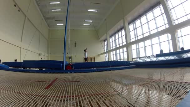 GOMEL, BELARUS - 22 April 2017: Freestyle competitions among young men and women in 2004-2006. In the program trampoline and gymnastic path — Stock Video