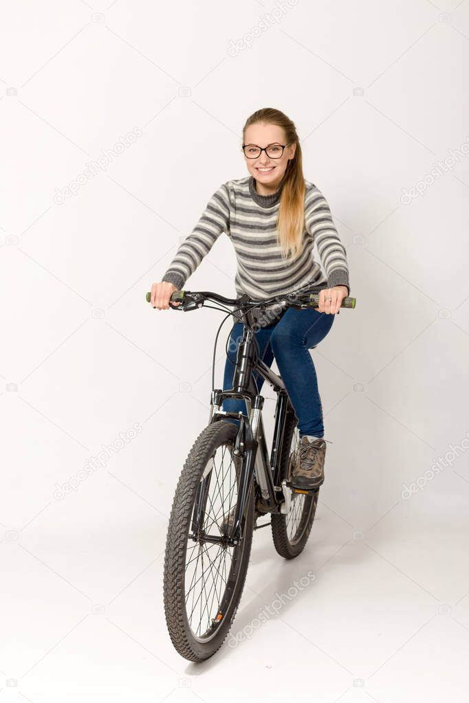 GOMEL, BELARUS - May 12, 2017: Mountain bike TRACK on a white background. The girl is riding.