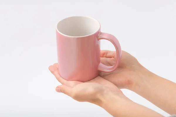 Female hands on a white background with a cup — Stock Photo, Image